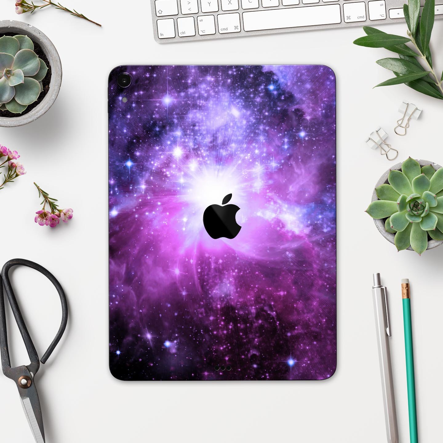 Violet Glowing Nebula skin decal for Apple iPad Pro, showcasing vibrant colors and a cosmic design.