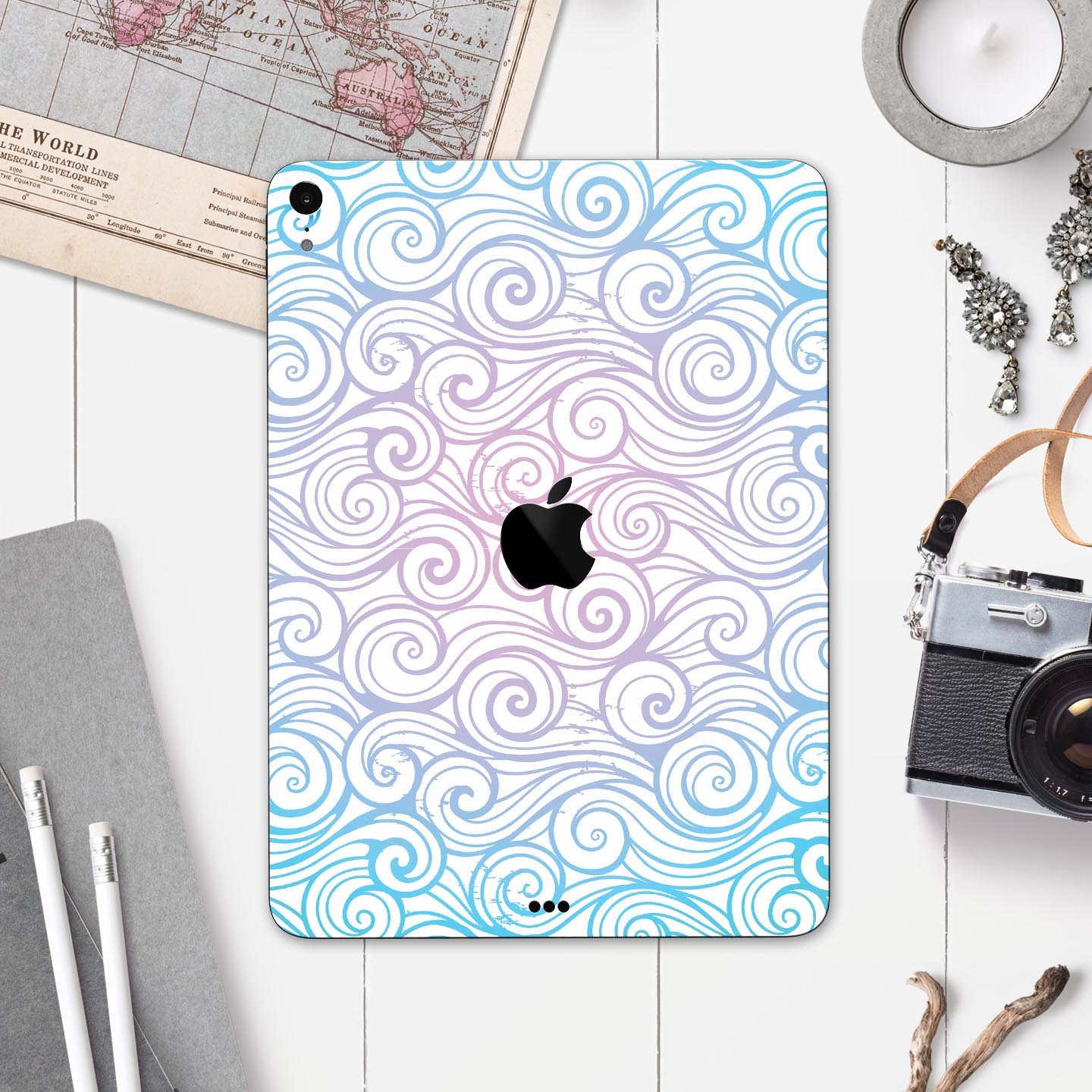 Vivid Blue Gradient Swirl skin decal for Apple iPad, showcasing vibrant colors and a sleek design.