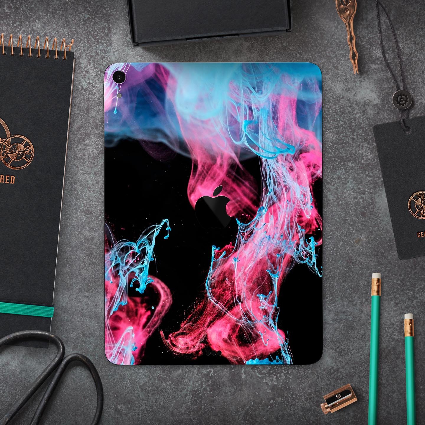 Vivid Pink and Teal liquid Cloud skin decal for Apple devices, showcasing vibrant colors and a sleek design.