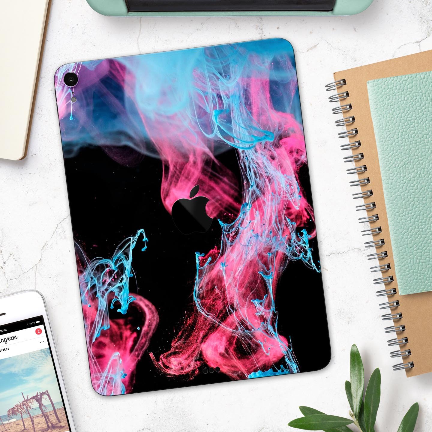 Vivid Pink and Teal liquid Cloud skin decal for Apple devices, showcasing vibrant colors and a sleek design.