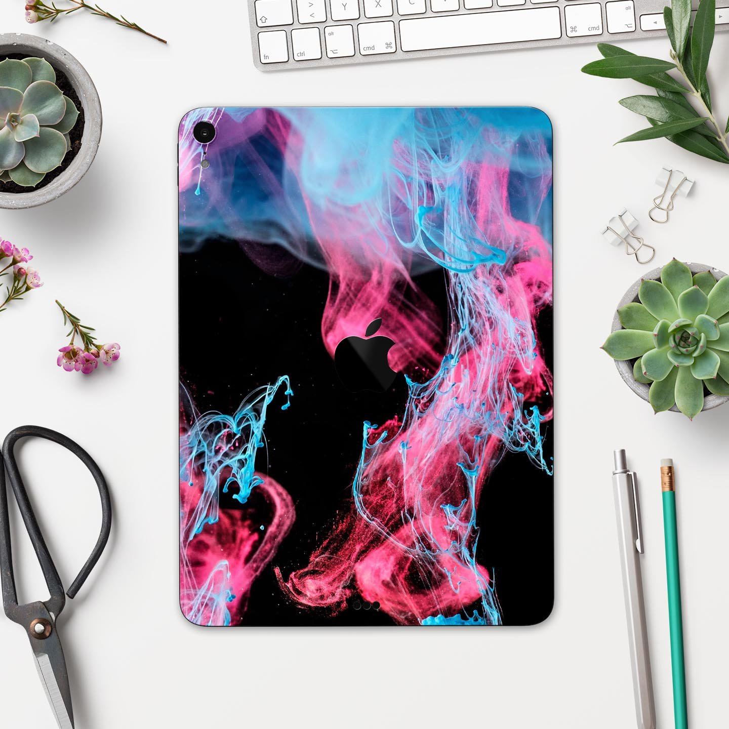 Vivid Pink and Teal liquid Cloud skin decal for Apple devices, showcasing vibrant colors and a sleek design.