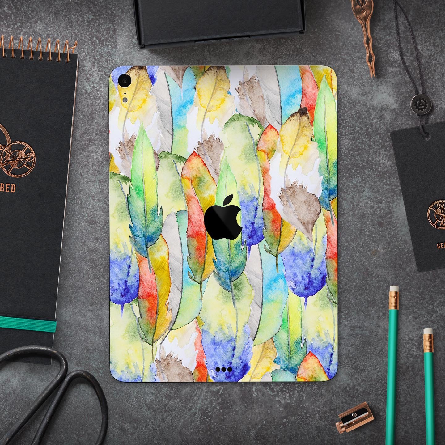 Vivid Watercolor Feather Overlay skin decal for Apple devices, showcasing vibrant colors and intricate feather design.