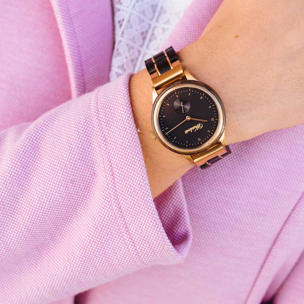 Waidzeit Mystic Gold Lady watch featuring bog oak and stainless steel design, showcasing its elegant craftsmanship.