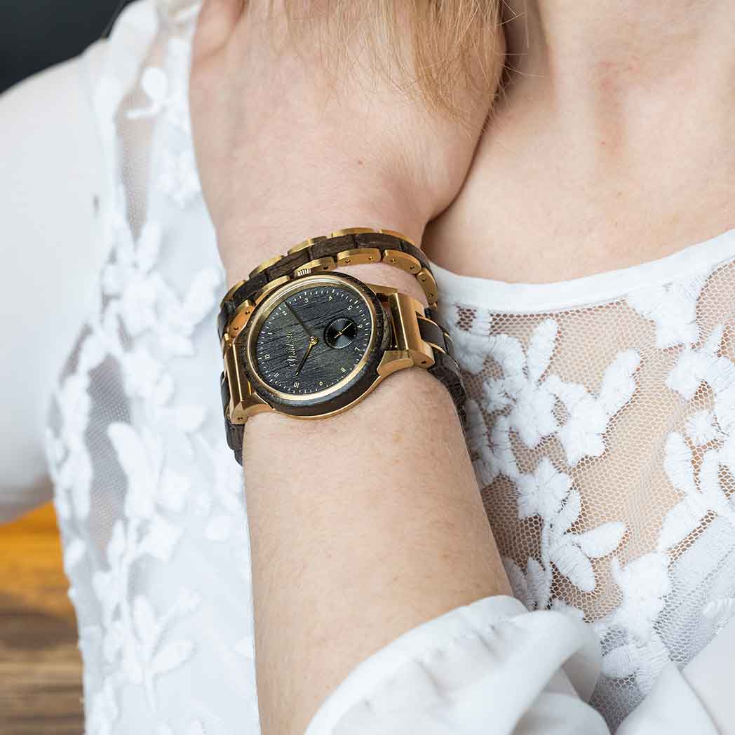 Waidzeit Mystic Gold Lady watch featuring bog oak and stainless steel design, showcasing its elegant craftsmanship.