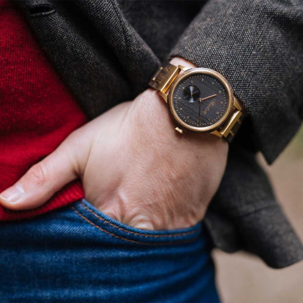 Waidzeit Mystic Gold Unisex watch featuring bog oak dial and golden stainless steel case, elegantly designed for style and comfort.