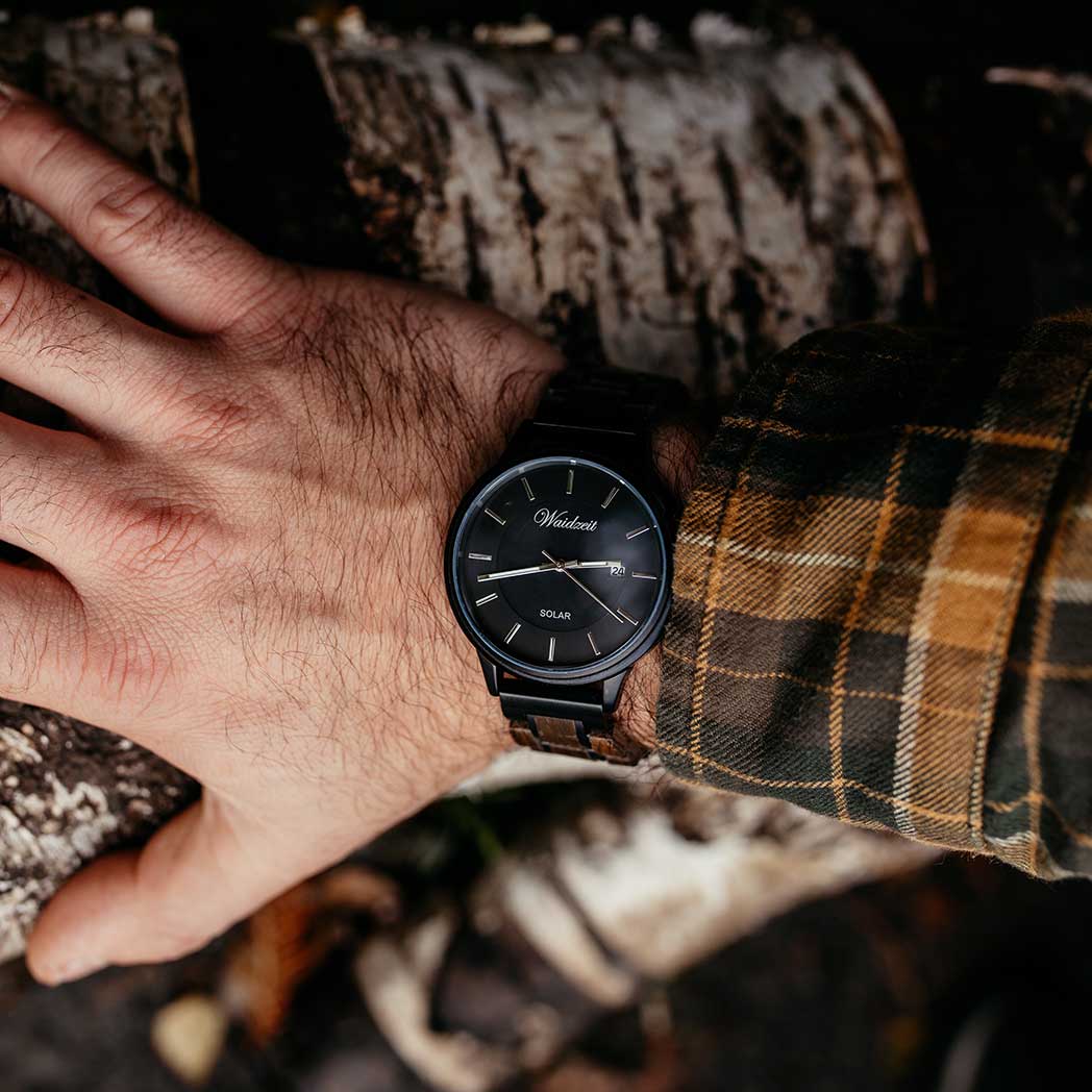 Waidzeit Mystic Solar watch featuring a bog oak case and wooden strap, showcasing solar technology and elegant design.