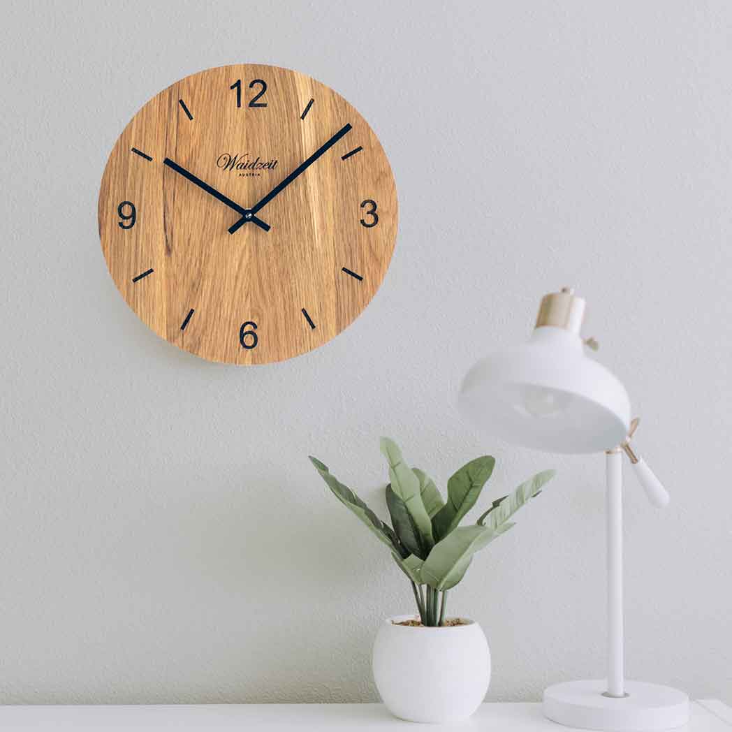 Waidzeit Wall Clock Tempus Oak featuring raised black hands and unique oak wood grain.