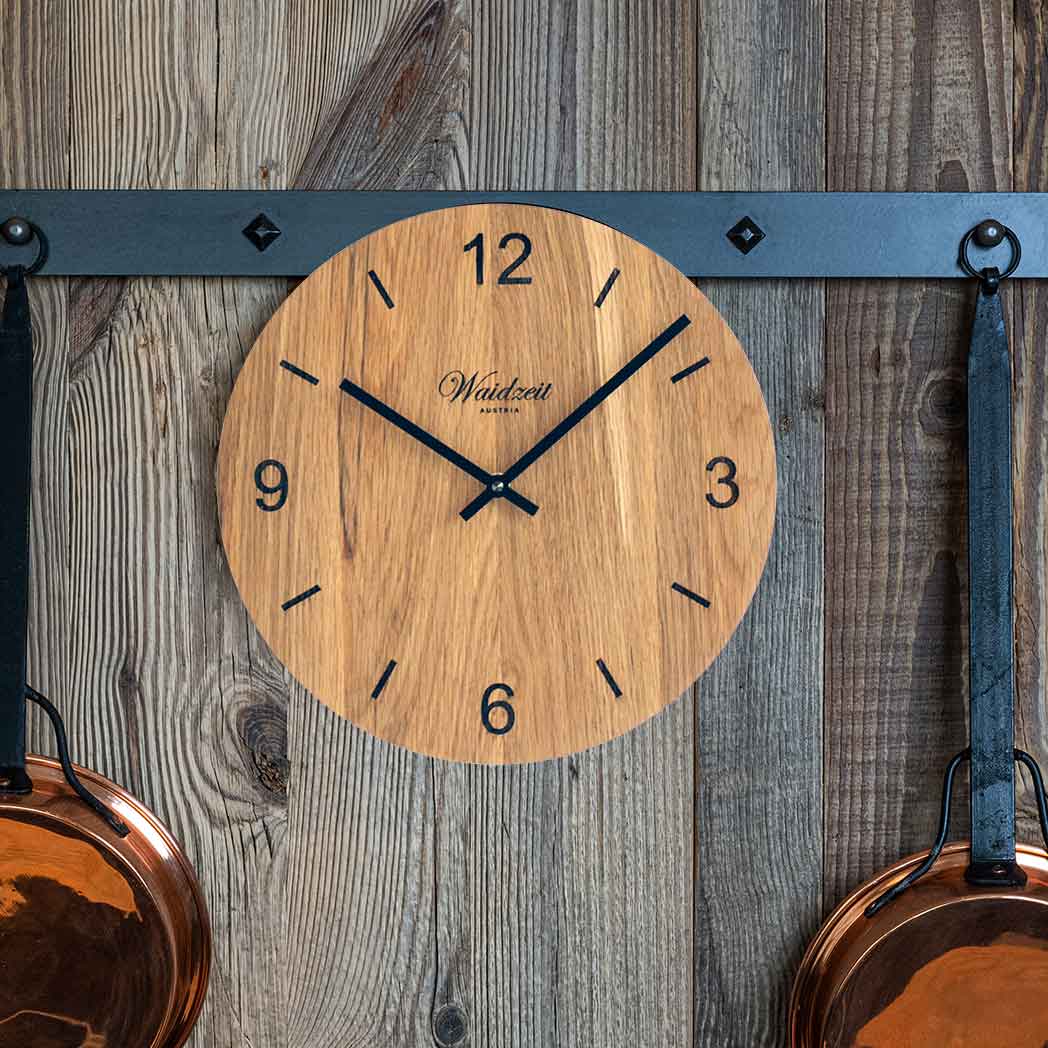 Waidzeit Wall Clock Tempus Oak featuring raised black hands and unique oak wood grain.