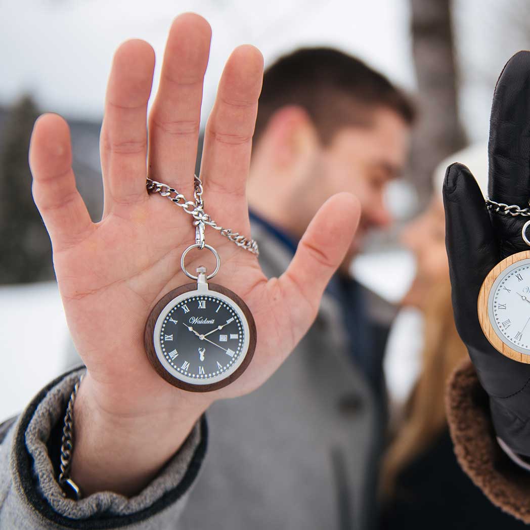 Waidzeit Walnut Antique Pocket Watch featuring a slate gray dial, Arabic numerals, and a wooden case with stainless steel accents.