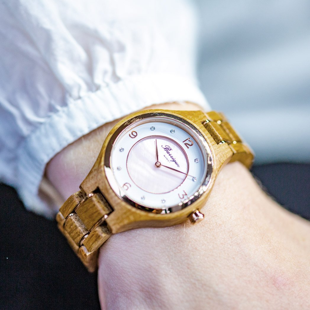 Waidzeit Wine Princess Rosé wooden watch featuring a rose-colored mother-of-pearl dial, crystal stones, and a stainless steel crown.