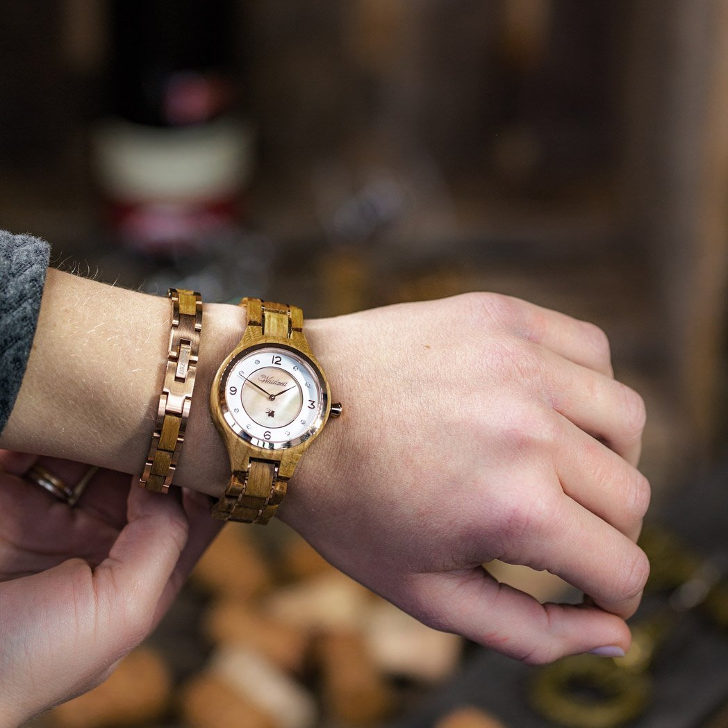 Waidzeit Wine Princess Rosé wooden watch featuring a rose-colored mother-of-pearl dial, crystal stones, and a stainless steel crown.