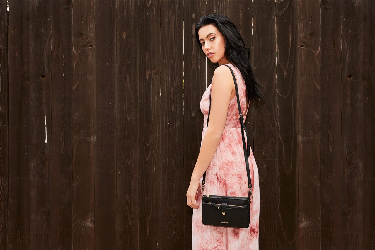 Stylish Wallet Crossbody made from genuine pebble leather with adjustable strap and card slots.