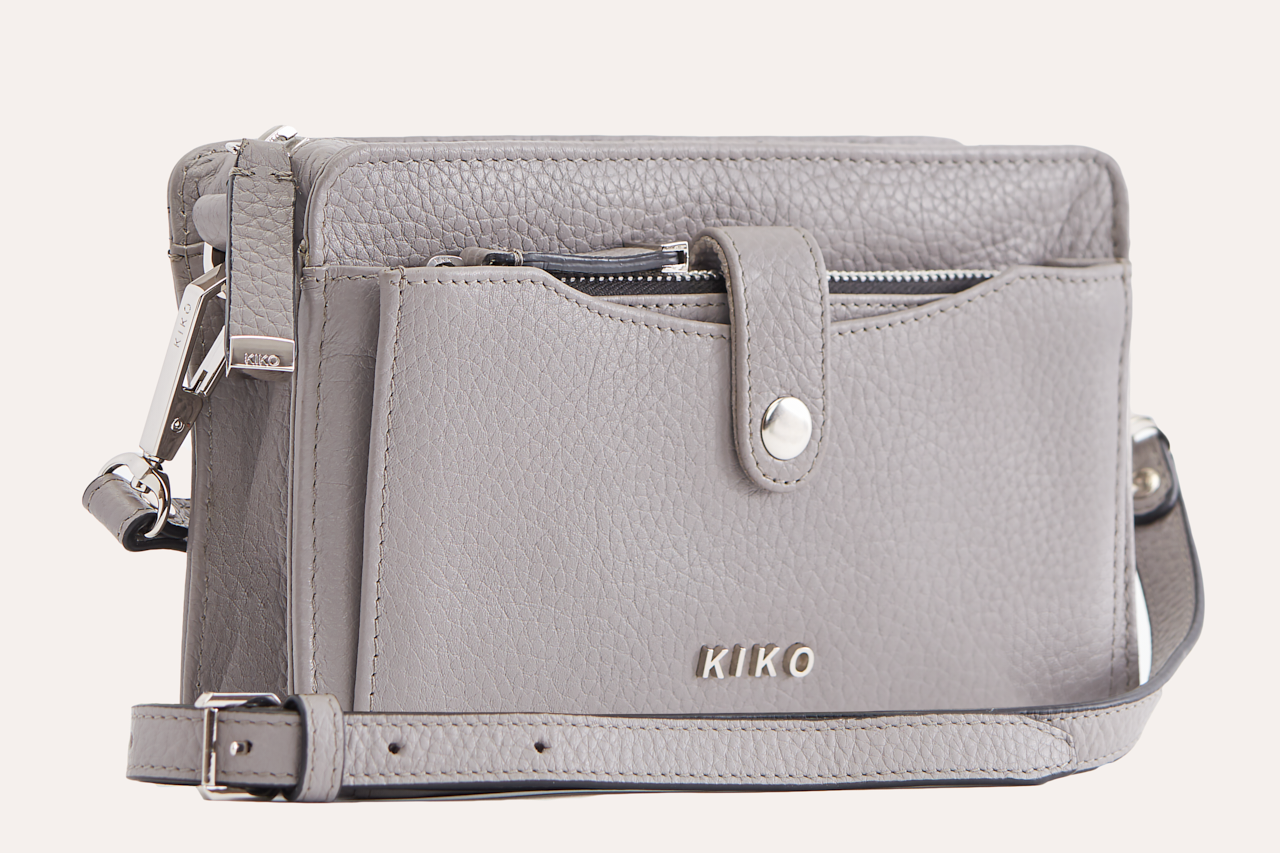 Stylish Wallet Crossbody made from genuine pebble leather with adjustable strap and card slots.