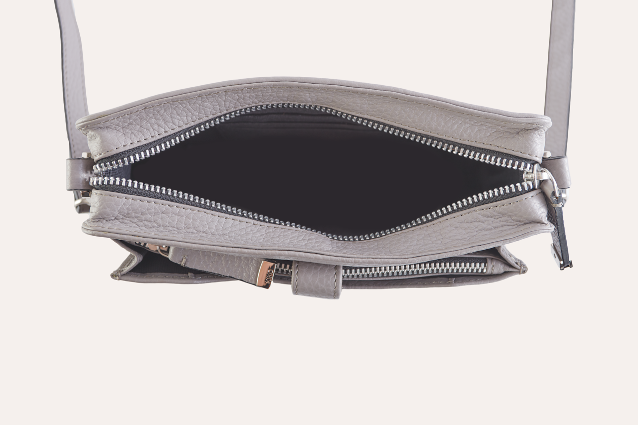 Stylish Wallet Crossbody made from genuine pebble leather with adjustable strap and card slots.