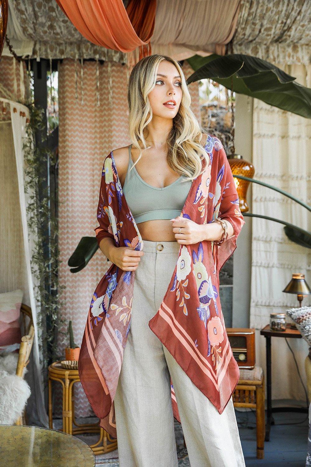 A stylish Wallflower Bloom Kimono with floral patterns and tassels, perfect for fall mornings.