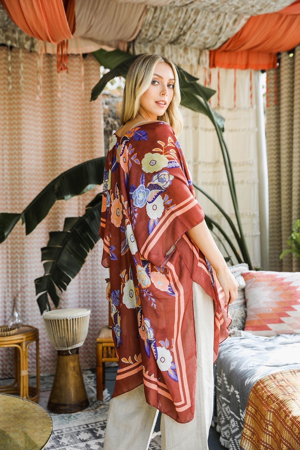 A stylish Wallflower Bloom Kimono with floral patterns and tassels, perfect for fall mornings.