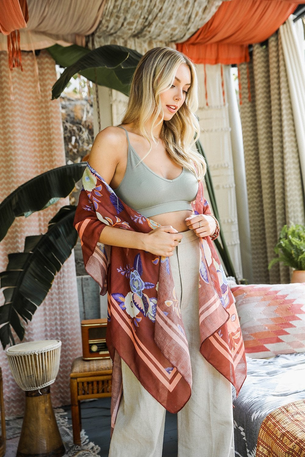 A stylish Wallflower Bloom Kimono with floral patterns and tassels, perfect for fall mornings.