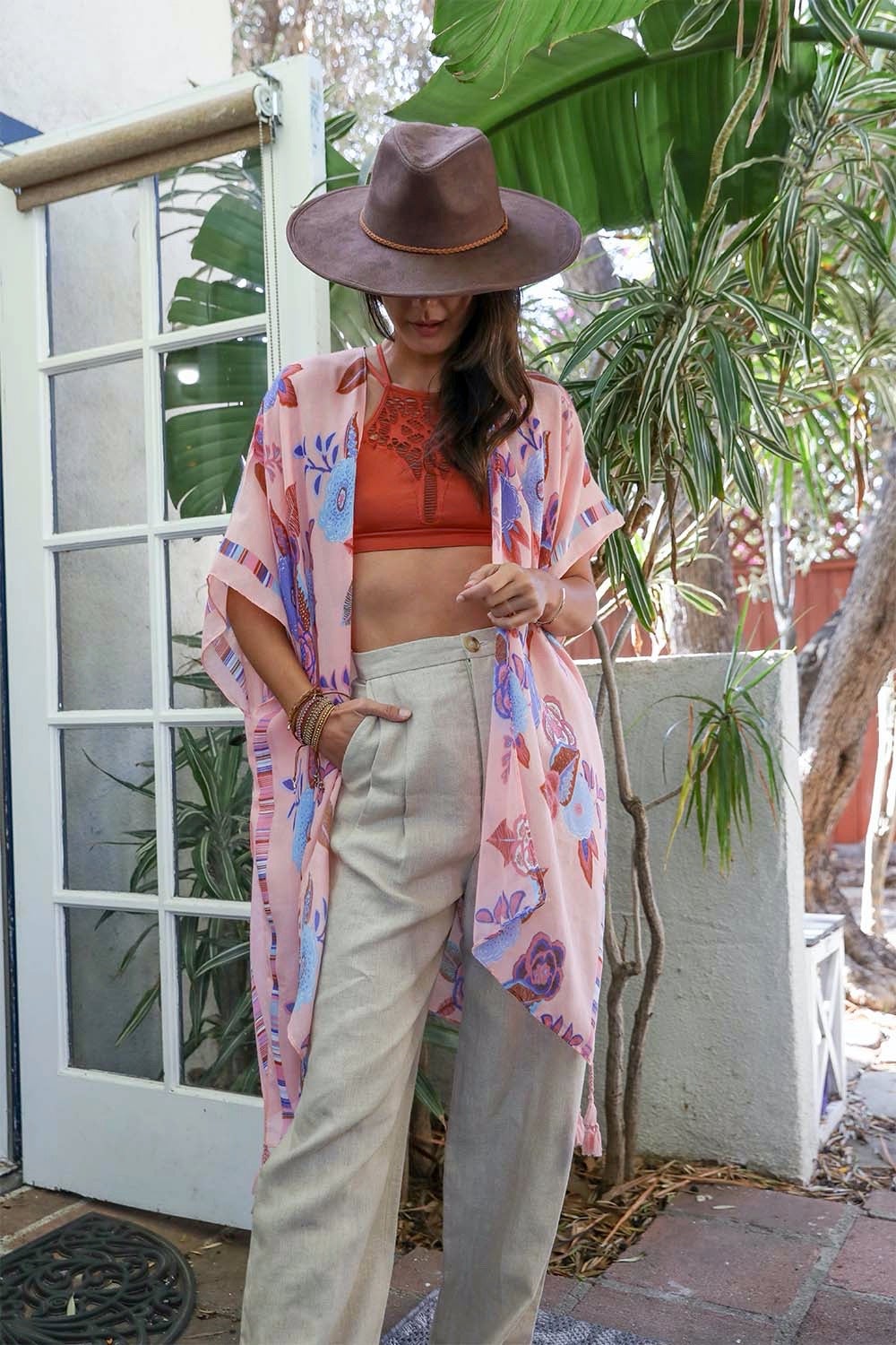 A stylish Wallflower Bloom Kimono with floral patterns and tassels, perfect for fall mornings.