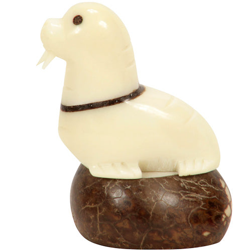 Hand-carved Walrus figurine made from tagua nut, showcasing natural colors and intricate details, symbolizing eco-friendly craftsmanship.