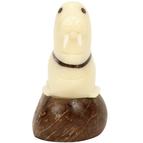 Hand-carved Walrus figurine made from tagua nut, showcasing natural colors and intricate details, symbolizing eco-friendly craftsmanship.