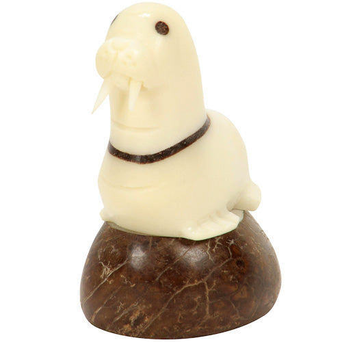 Hand-carved Walrus figurine made from tagua nut, showcasing natural colors and intricate details, symbolizing eco-friendly craftsmanship.