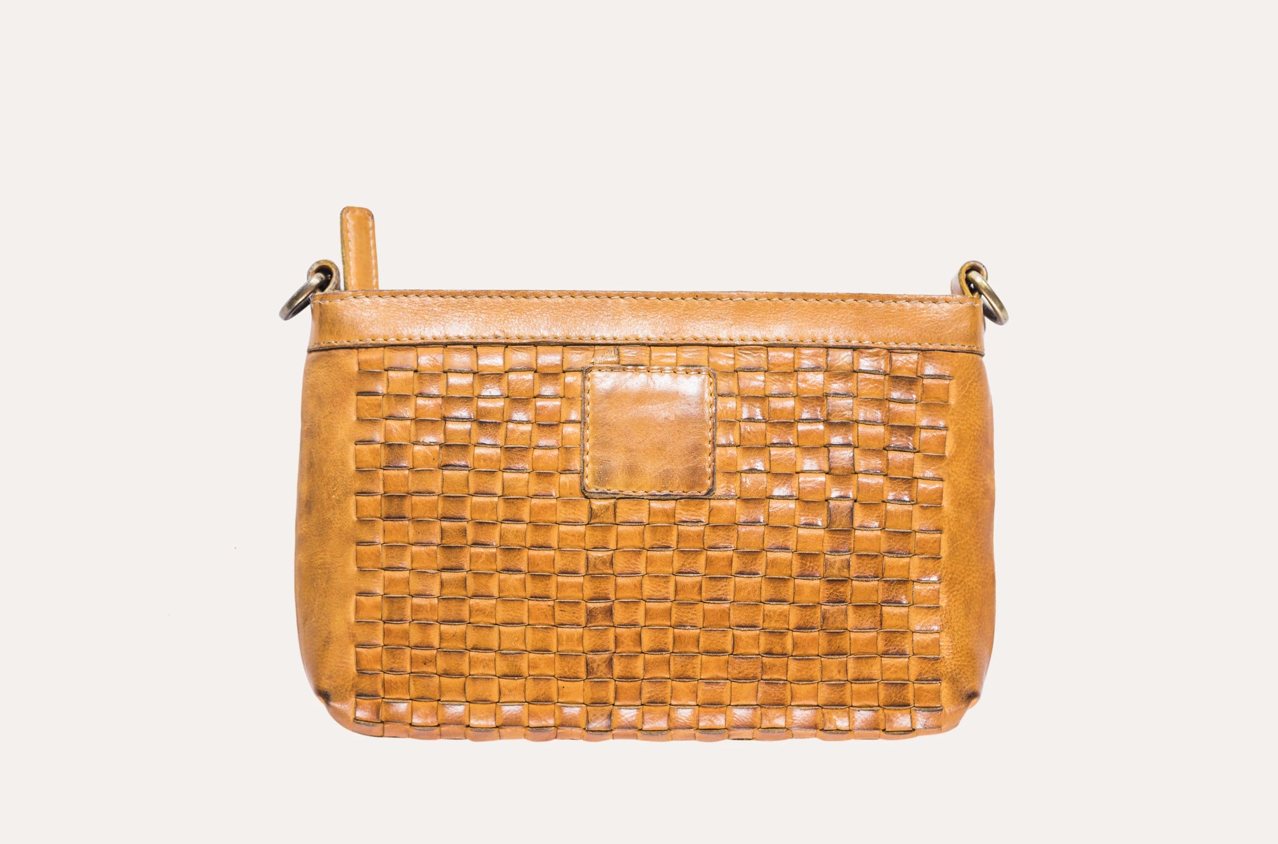 Stylish Weaved Crossbody bag made of genuine washed leather with adjustable strap and zipper pockets.