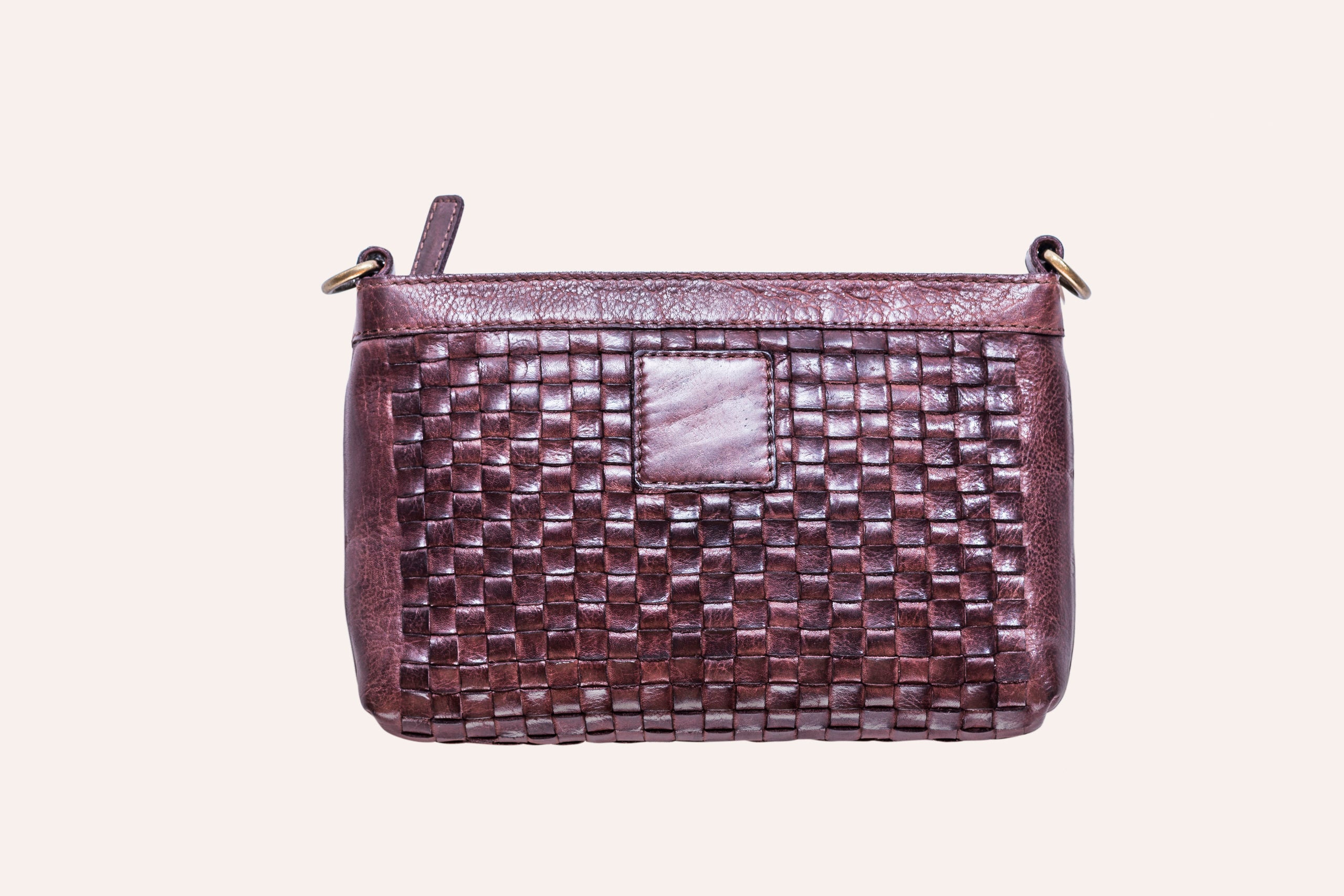 Stylish Weaved Crossbody bag made of genuine washed leather with adjustable strap and zipper pockets.