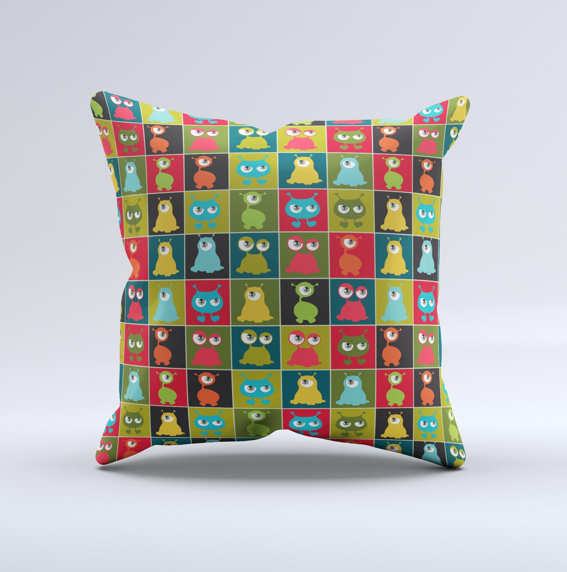 A decorative throw pillow featuring weird abstract eyeball creatures, showcasing vibrant colors and unique hand-produced graphics.