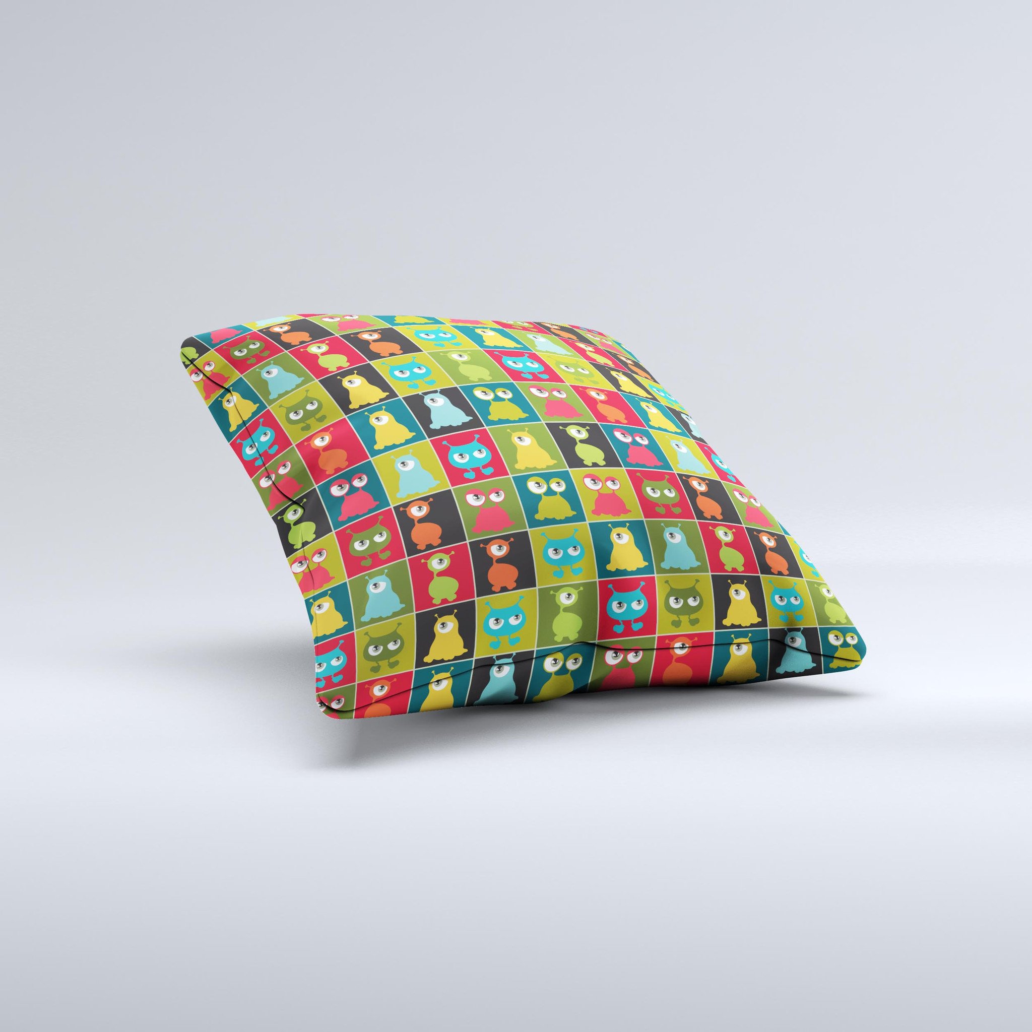 A decorative throw pillow featuring weird abstract eyeball creatures, showcasing vibrant colors and unique hand-produced graphics.