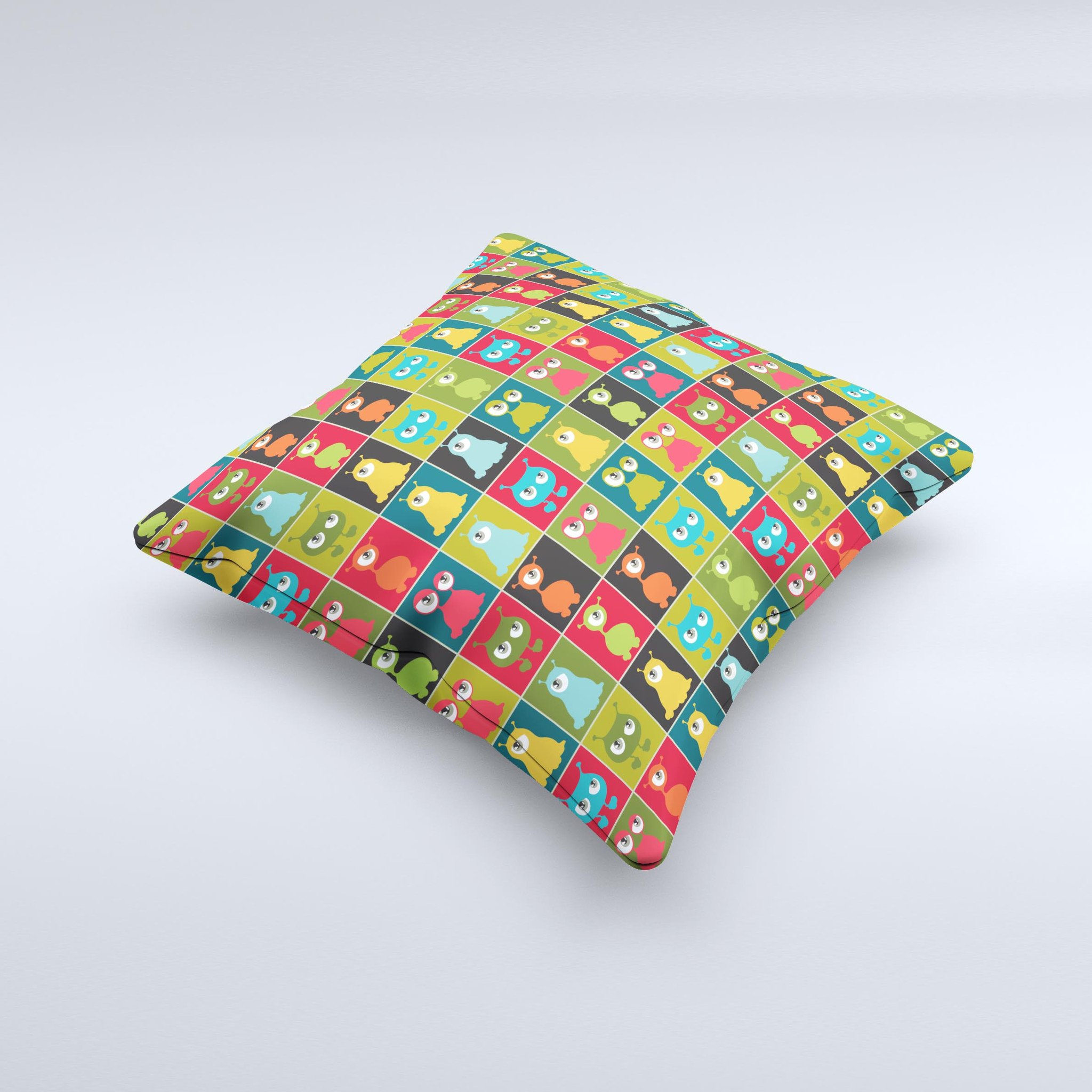 A decorative throw pillow featuring weird abstract eyeball creatures, showcasing vibrant colors and unique hand-produced graphics.