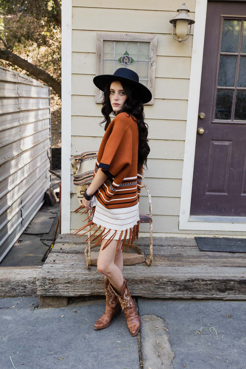 A stylish Western Luxe Fringed Ruana featuring a chic fringe design, perfect for winter wear.