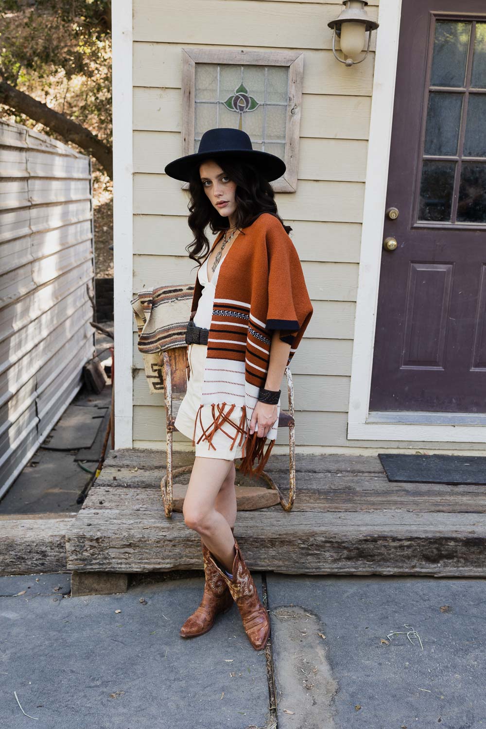 A stylish Western Luxe Fringed Ruana featuring a chic fringe design, perfect for winter wear.