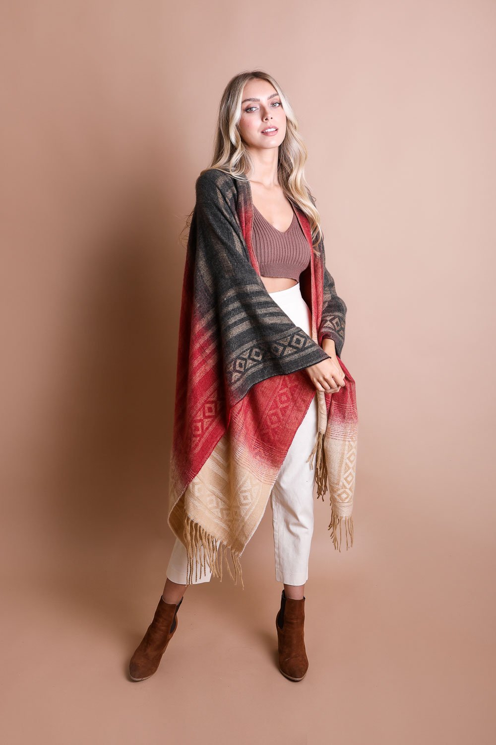 A colorful Western style serape with tassels, showcasing a blend of bohemian colors, perfect for layering and personal expression.