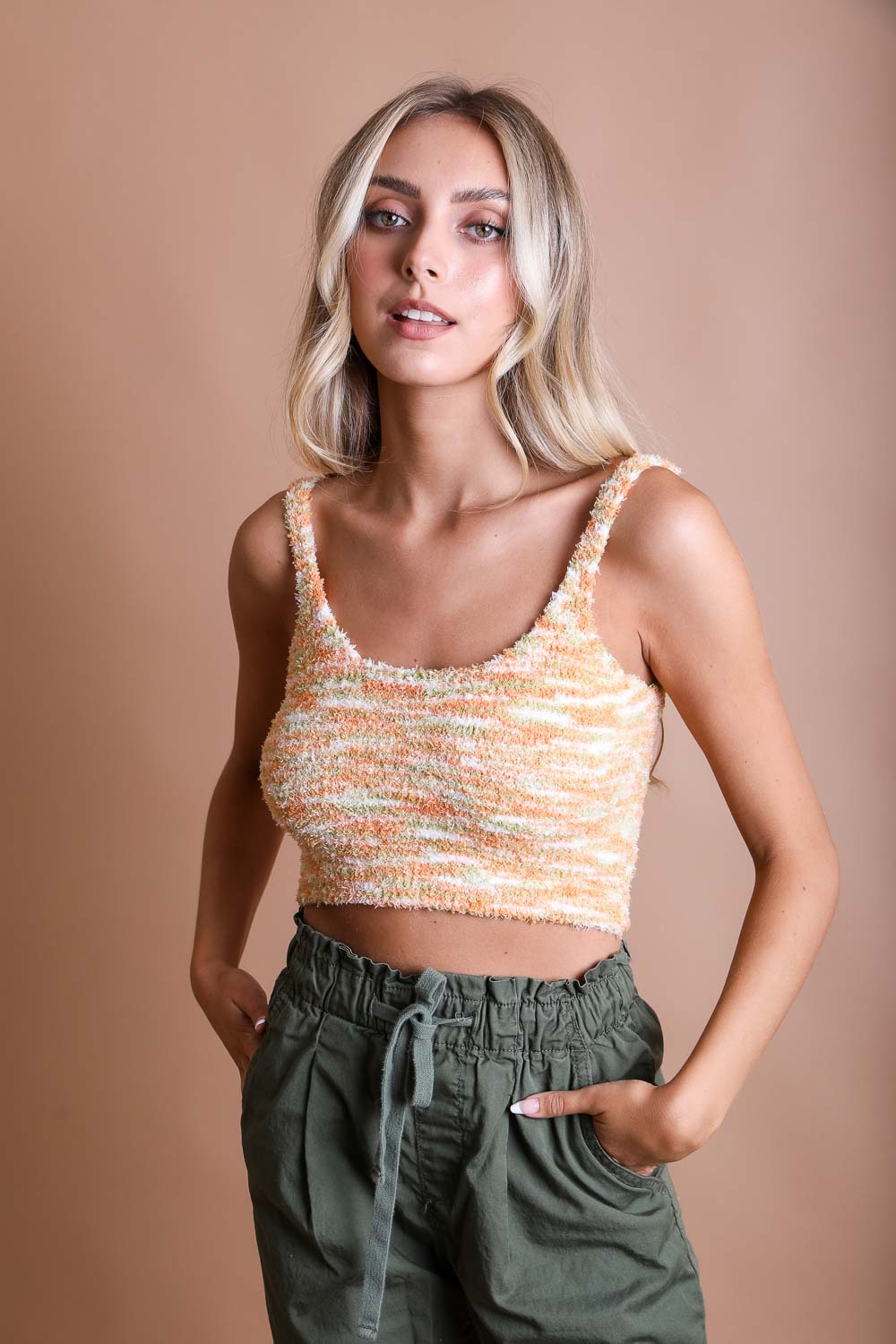 A soft and lightweight Whimsical Boucle Brami top in various fun colors, showcasing its playful design and cozy fabric.