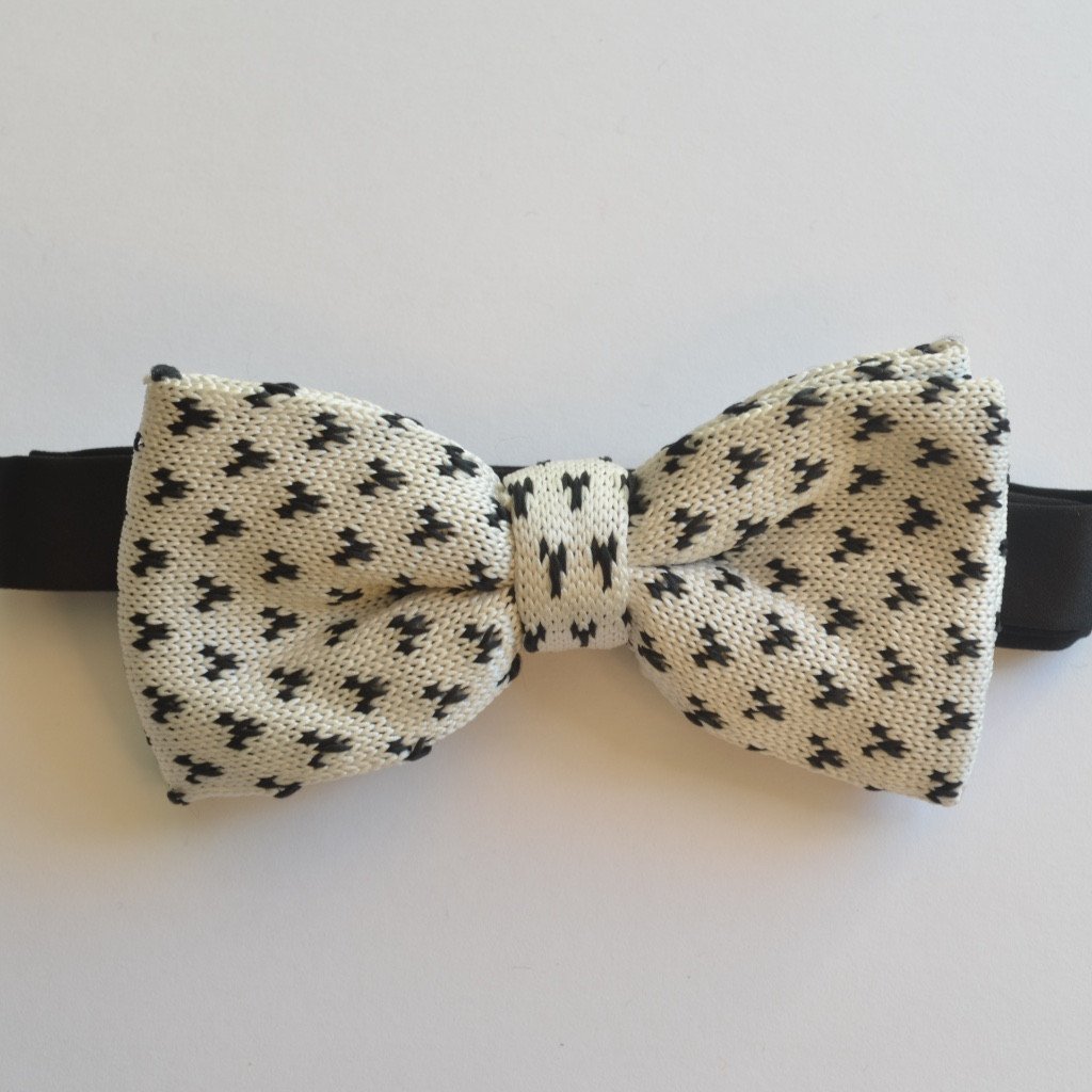 A stylish White and Black detailed knit bow tie, showcasing its elegant design and texture.