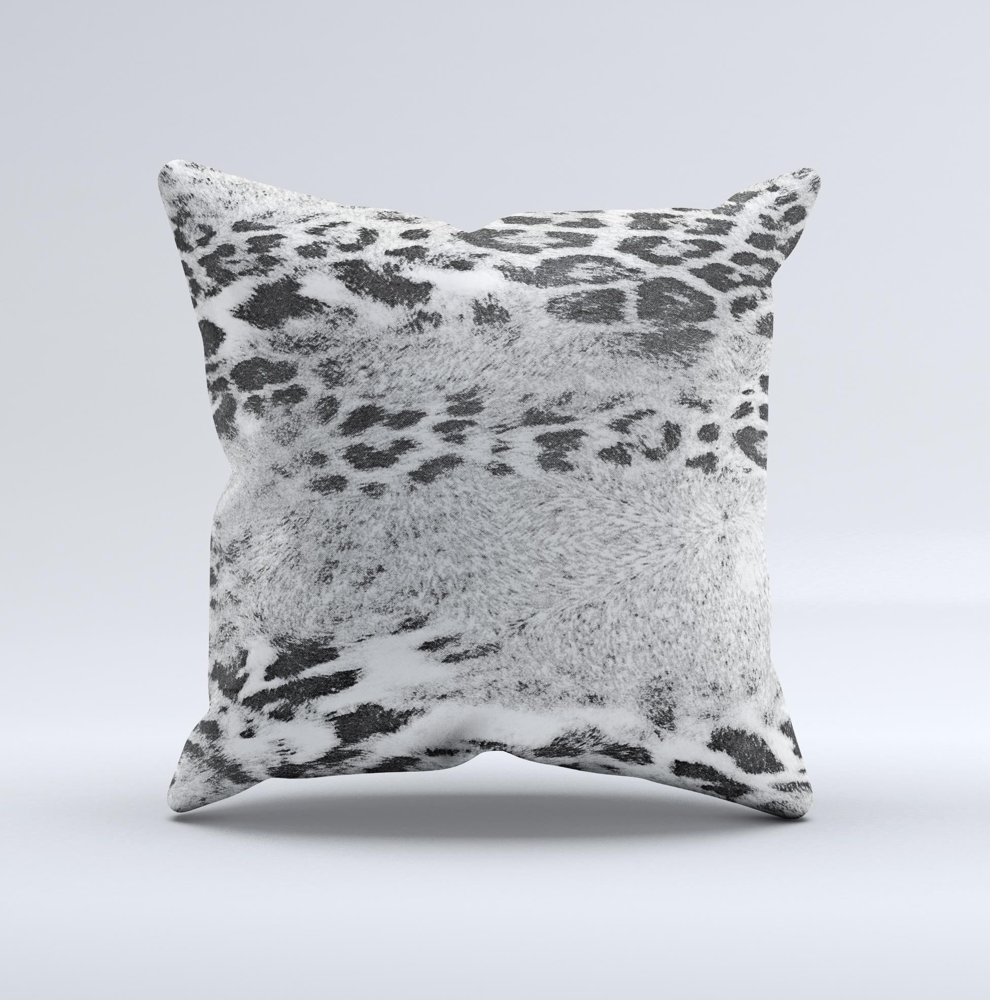 A stylish white and black decorative throw pillow featuring a real leopard print design, handcrafted in Virginia with high-quality materials.