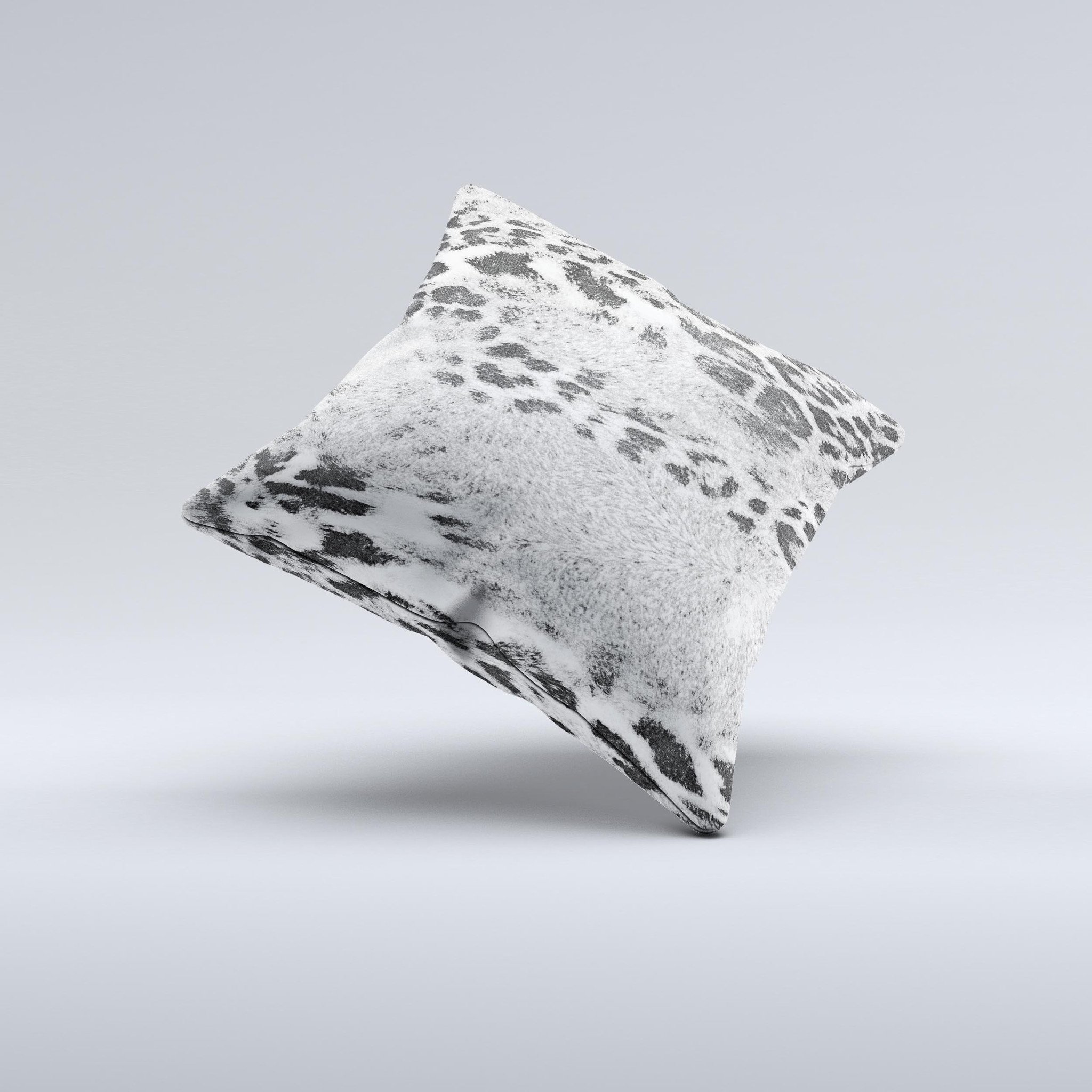 A stylish white and black decorative throw pillow featuring a real leopard print design, handcrafted in Virginia with high-quality materials.