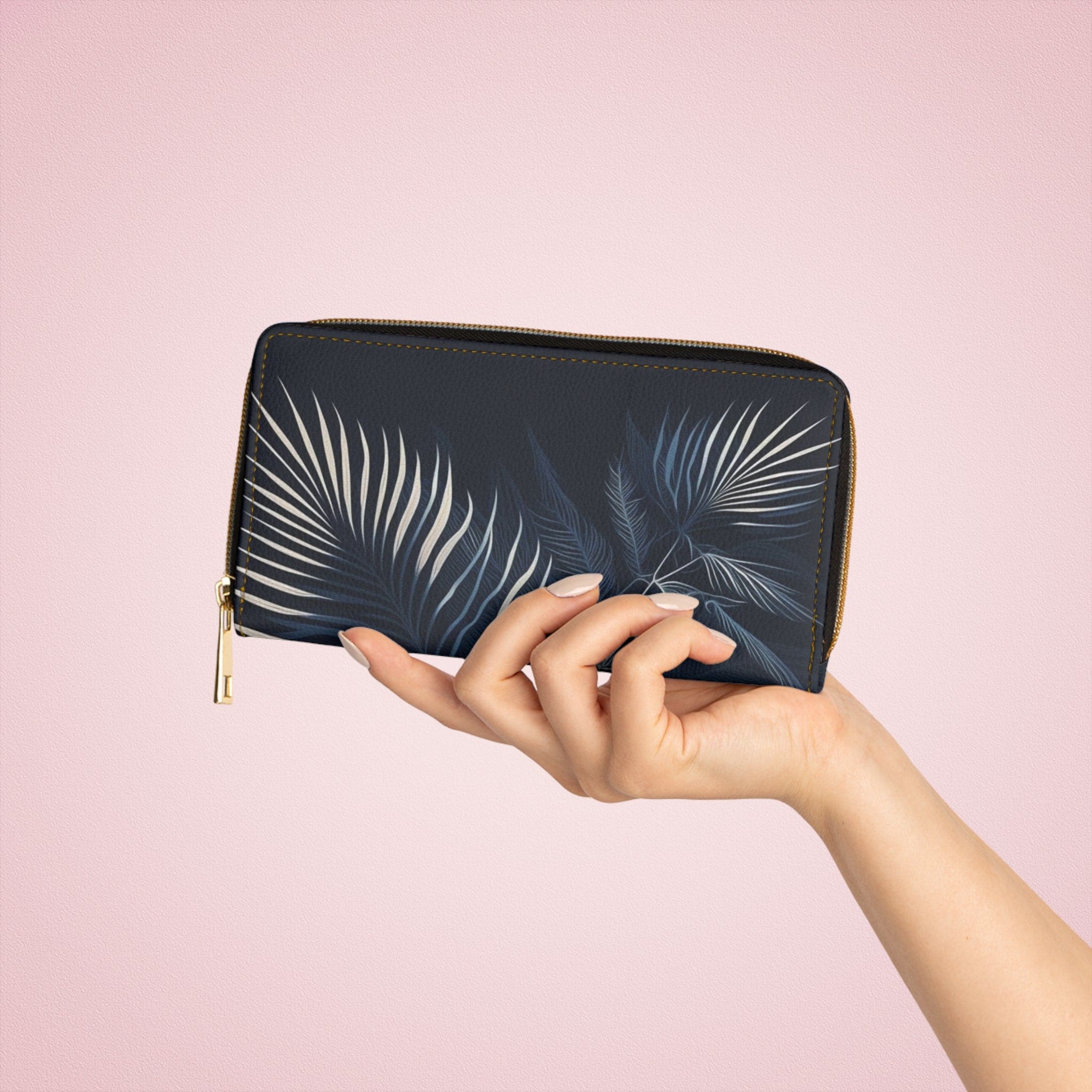 Stylish navy blue wallet featuring white line art of palm tree leaves, perfect for women.