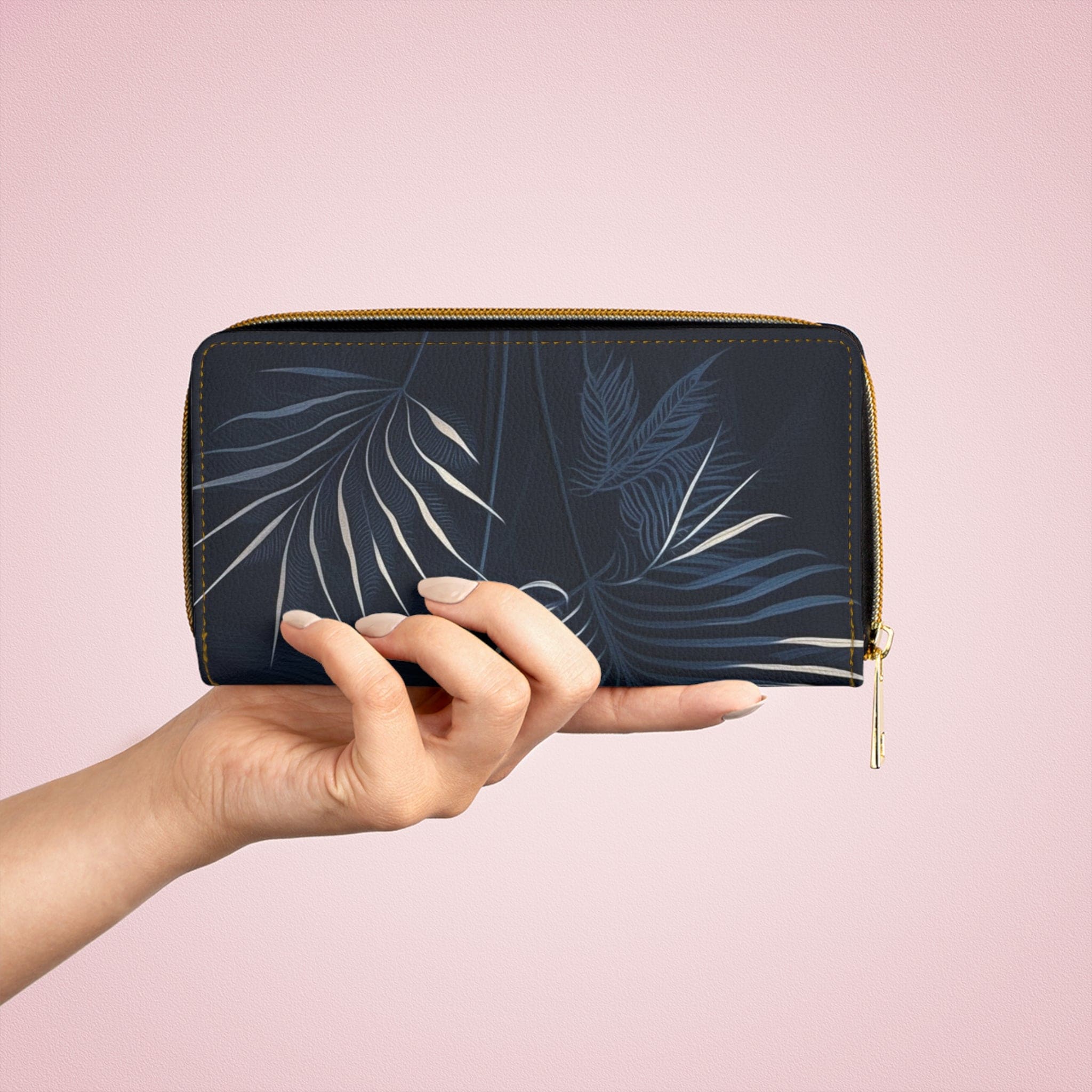 Stylish navy blue wallet featuring white line art of palm tree leaves, perfect for women.