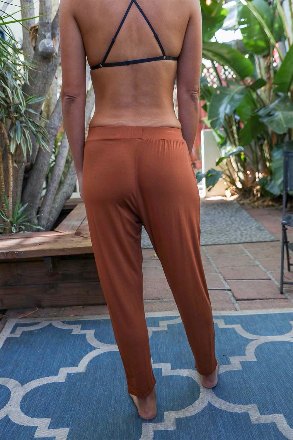 A pair of stylish Wide Band Lounge Pants featuring a wide elastic waistband and two side pockets, made from soft Modal and Spandex fabric.