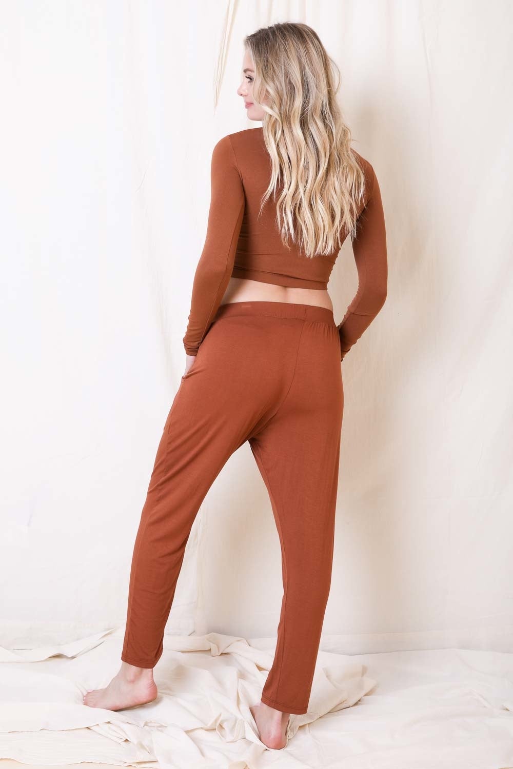 A pair of stylish Wide Band Lounge Pants featuring a wide elastic waistband and two side pockets, made from soft Modal and Spandex fabric.