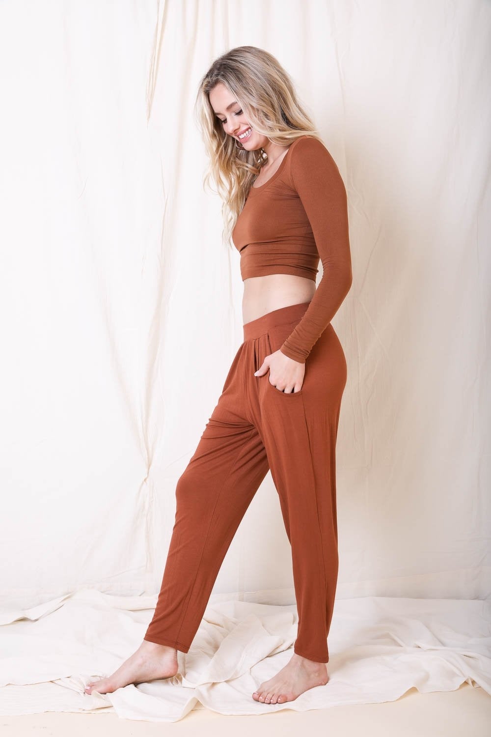 A pair of stylish Wide Band Lounge Pants featuring a wide elastic waistband and two side pockets, made from soft Modal and Spandex fabric.