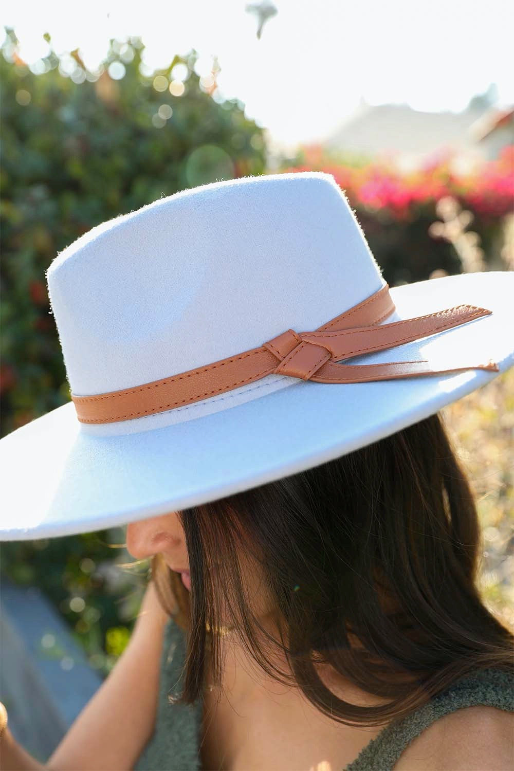 Wide Brim Leather Ribbon Bolero Hat featuring a stylish leather ribbon and a broad brim for sun protection.