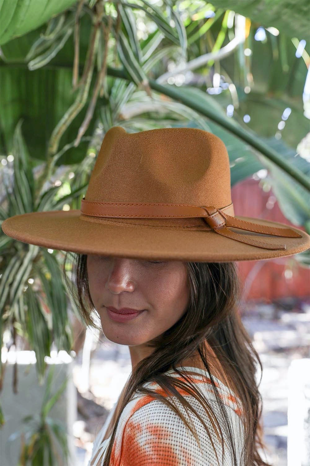 Wide Brim Leather Ribbon Bolero Hat featuring a stylish leather ribbon and a broad brim for sun protection.