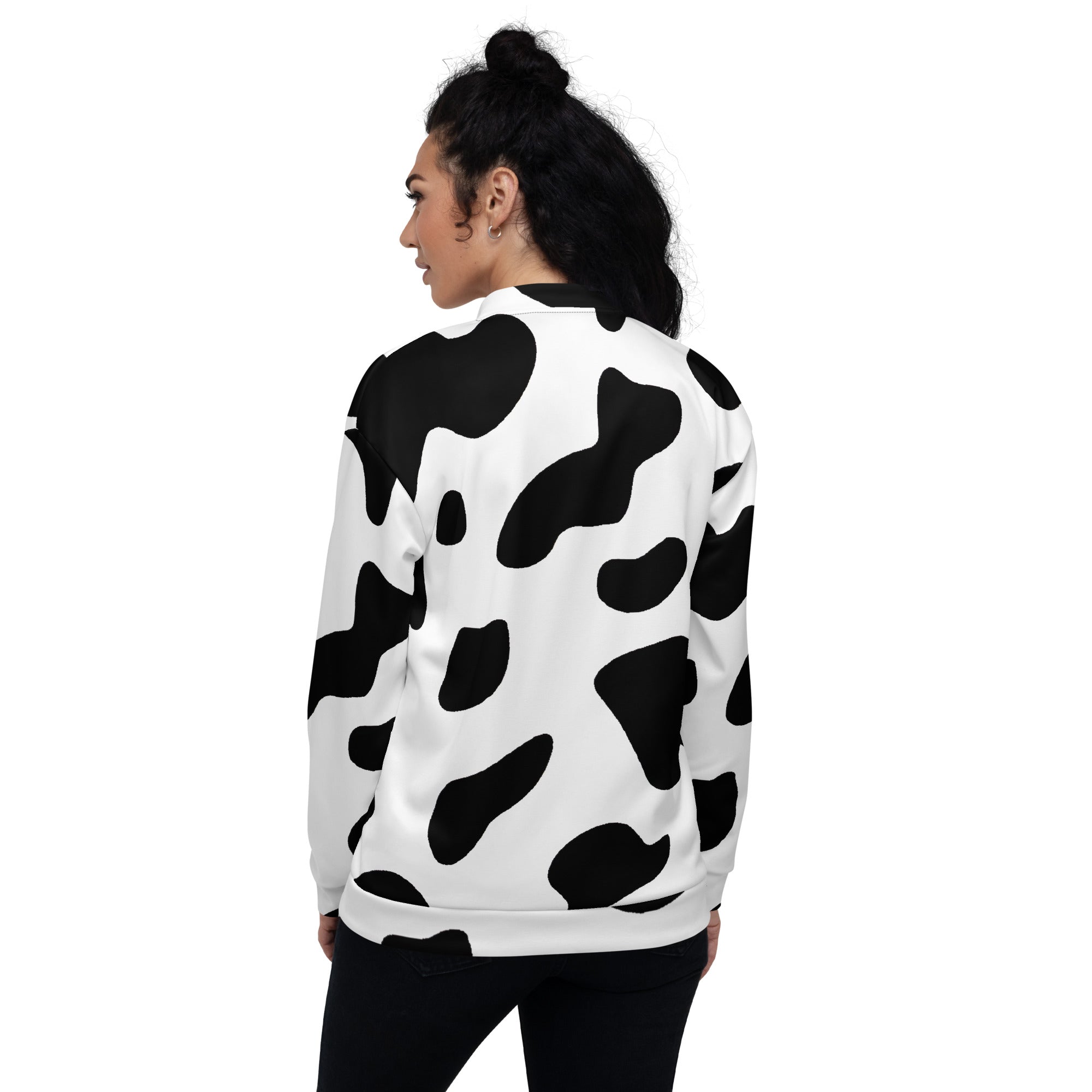 Women's bomber jacket featuring a stylish black and white cow print design, zip-front closure, and ribbed cuffs.