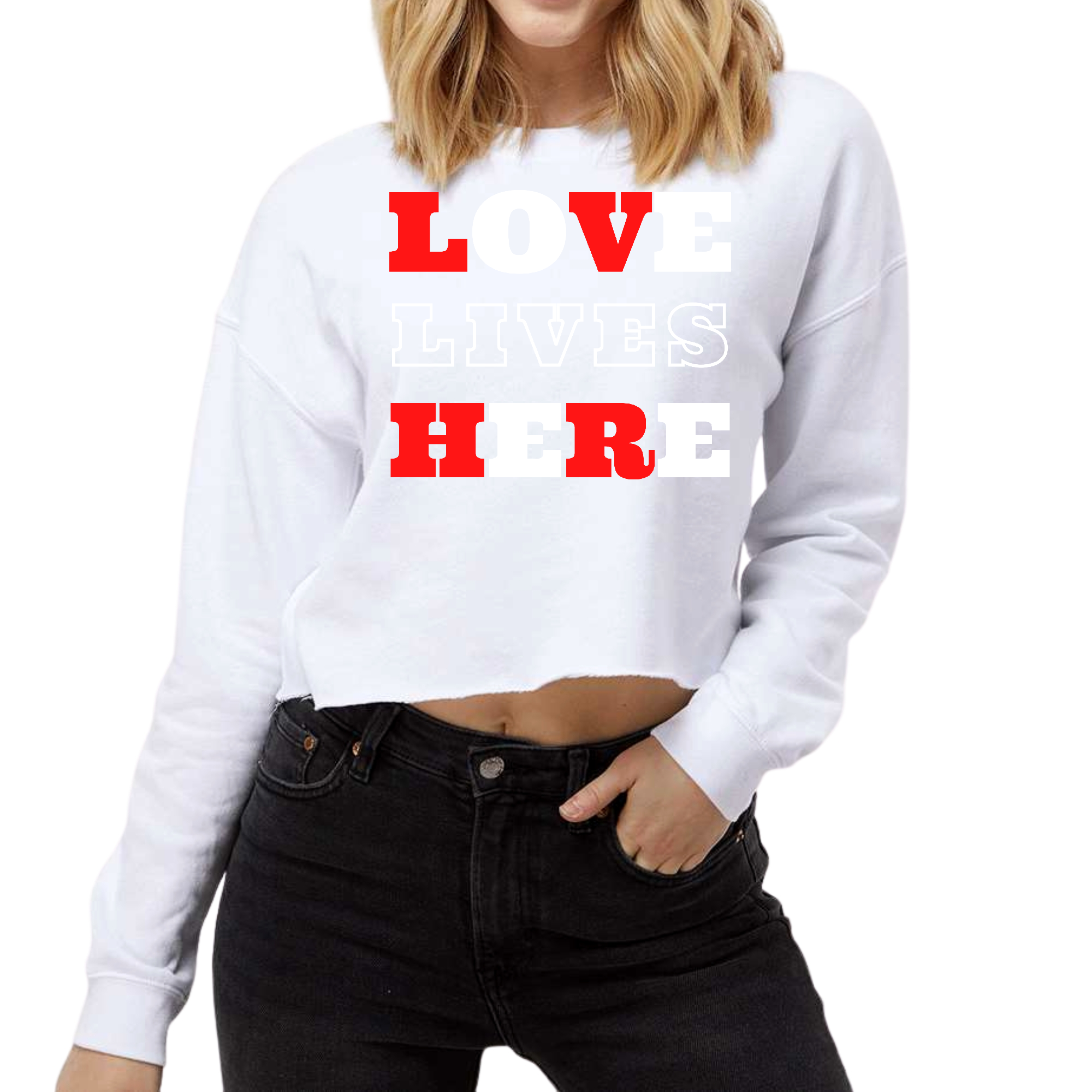 Women's cropped graphic sweatshirt in heather grey with 'Love Lives Here' print, featuring a crew neckline and ribbed cuffs.