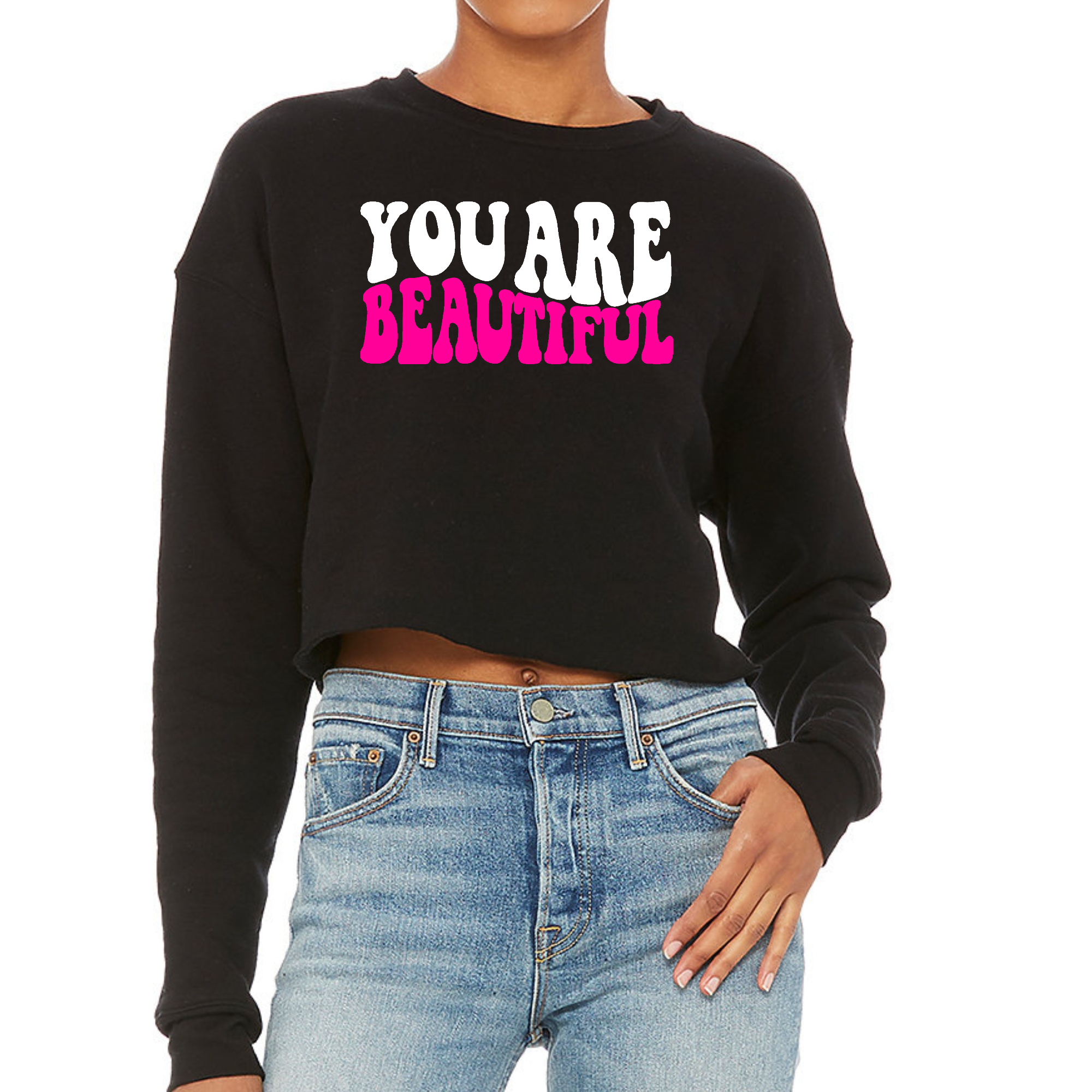 Women's cropped graphic sweatshirt in pink and white with 'You Are Beautiful' design, showcasing a relaxed fit and soft fleece material.