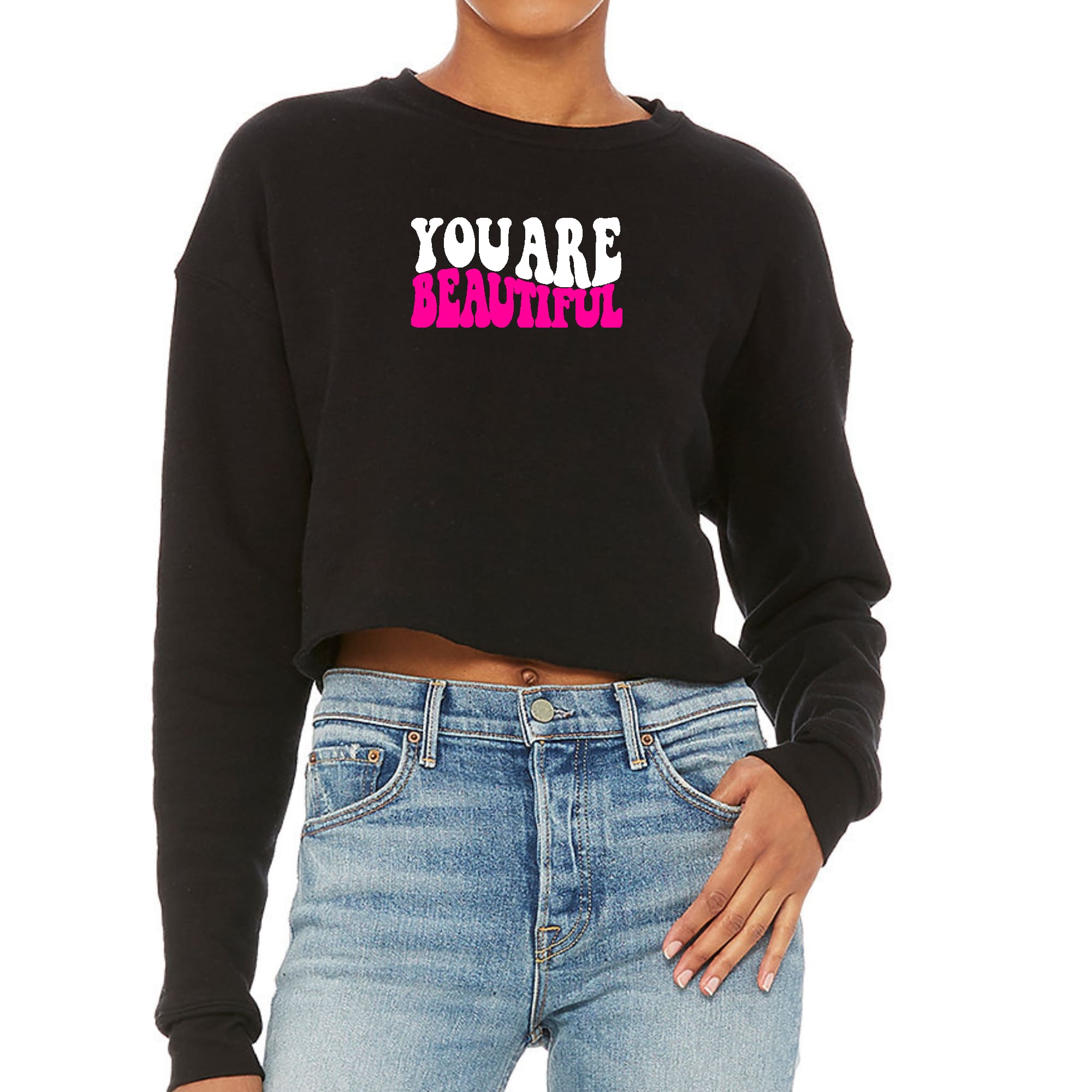 Women's cropped graphic sweatshirt in pink and white with 'You Are Beautiful' design, showcasing a relaxed fit and soft fleece material.