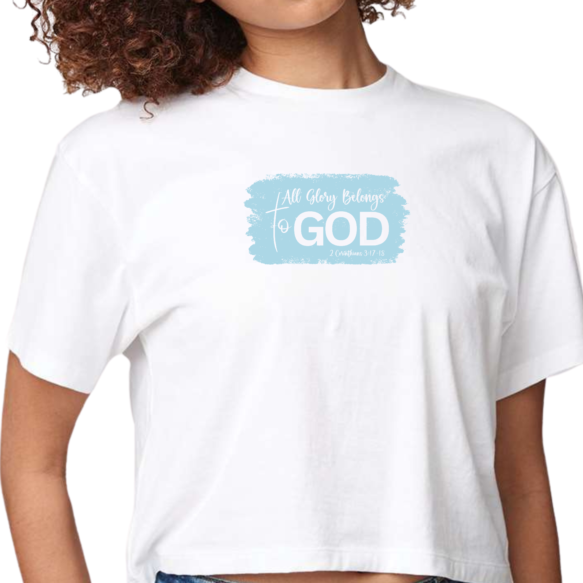 Light blue women's cropped graphic t-shirt with 'All Glory Belongs to God' illustration, made from soft preshrunk cotton.