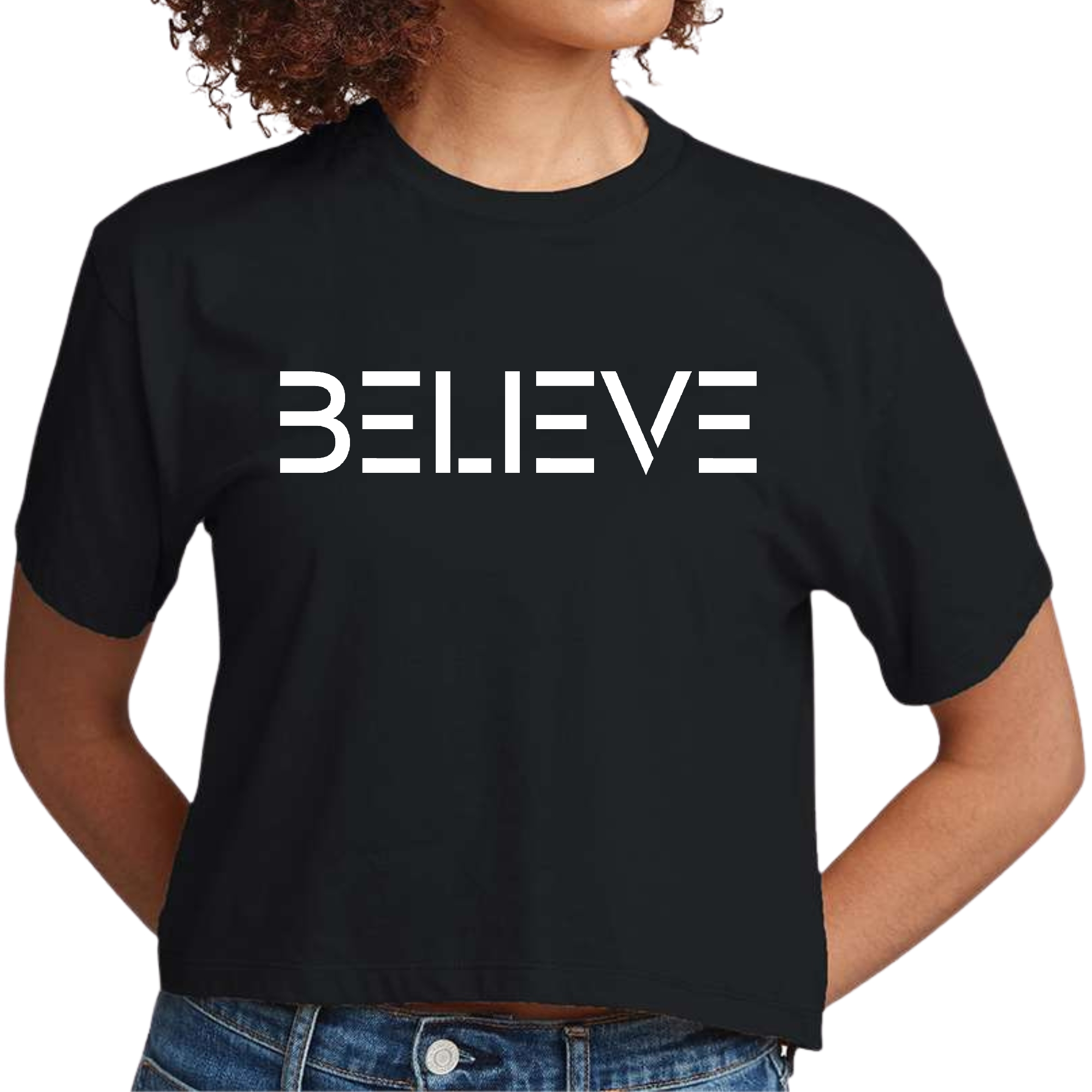 Women's cropped graphic t-shirt in white featuring an inspirational 'Believe' print, made from soft preshrunk cotton.